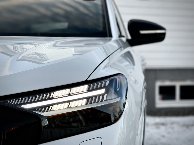 Audi Q4 50 e-tron quattro S-line in Glacier white with black optics and full body paint