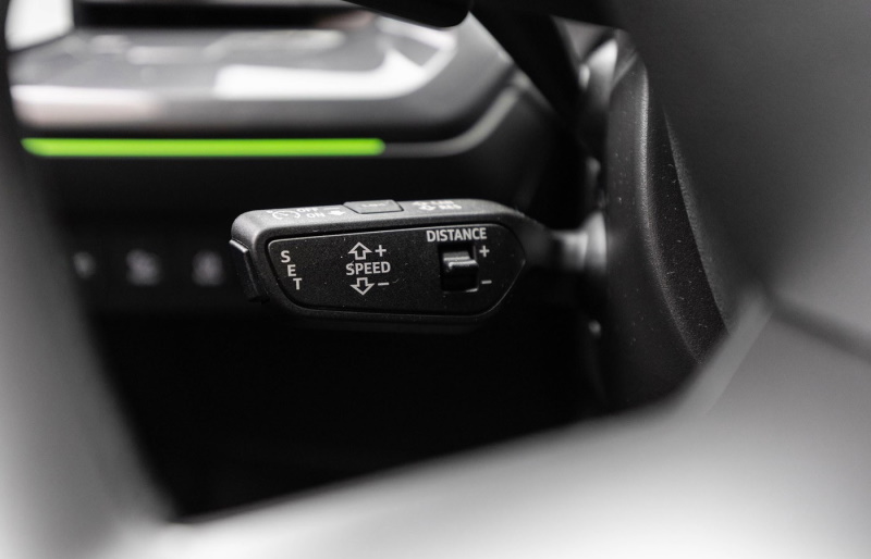 The cruise control handle controls the function including controlling the distance to the car in front.